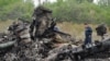 Armata ucraineană şi separatiştii pro-ruşi se acuză reciproc că ar fi provocat prăbuşirea avionului malaezian