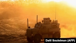 A U.S. army vehicle supporting the Syrian Democratic Forces (SDF) is seen in Hajin, in the Deir Ezzor province, December 15, 2018