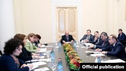 Armenia - Prime Minister Hovik Abrahamian (R) meets with the Yerevan-based representatives of the IMF and the World Bank, 17Dec2014.