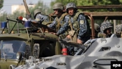 Uzbek special forces patrol the streets of Andijon on May 17, 2005.