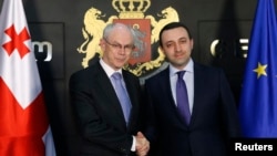 Еуропа кеңесінің президенті Херман ван Ромпей (сол жақта) мен Грузия премьер-министрі Ираклий Гарибашвили. 14 мамыр 2014 жыл.