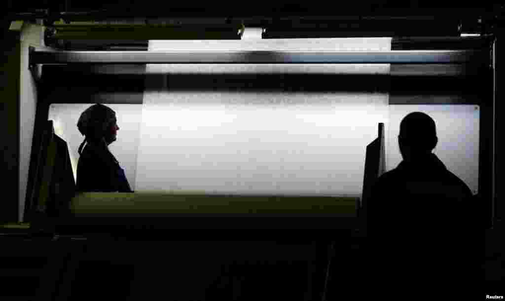 Employees work on the production of fabrics at a factory in Svetlogorsk, Belarus. (Reuters/Vasily Fedosenko)