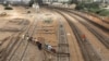 Labourers from the Pakistan Railways are seen working on railway tracks along City Station in Karachi, Pakistan on September 24.