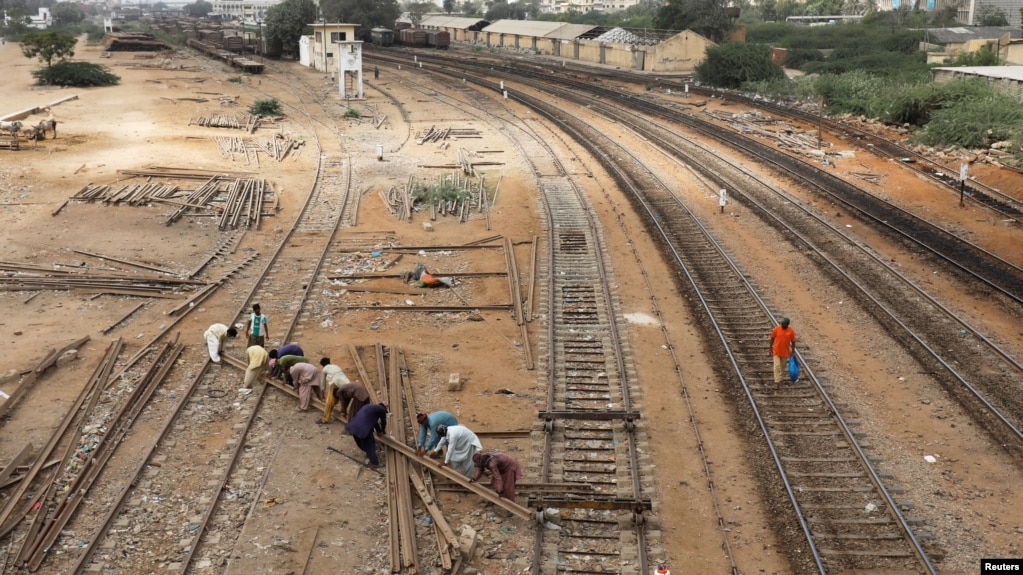 Fearing Debt Trap Pakistan Rethinks Chinese Silk Road Projects - labourers from the pakistan railways are seen working on railway tracks along city station in karachi