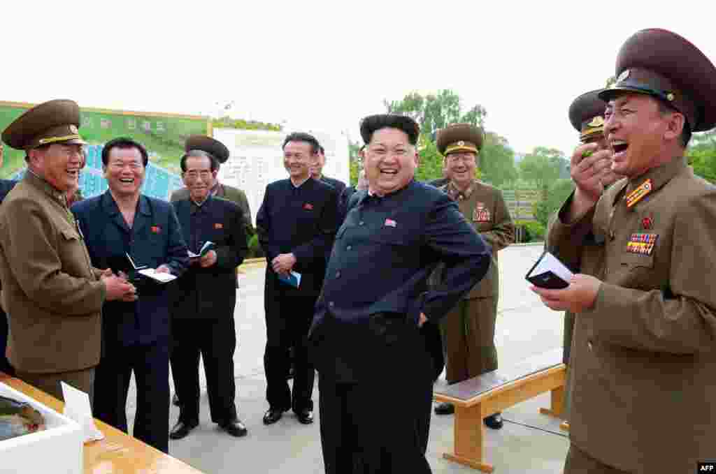 North Korean leader Kim Jong-Un (center) during an inspection of a Sinchang fish farm at an undisclosed location. (AFP)