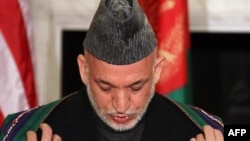 Is Afghan President Hamid Karzai doing enough to fight corruption is his administration?