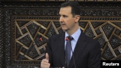 Syrian President Bashar al-Assad delivers a speech to Syria's parliament in Damascus on June 3.