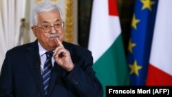 Palestinian President Mahmud Abbas speaks during a press conference in Paris on December 22.