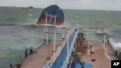 This photo taken from a video released by the Russian Southern Transport Prosecutor's Office, shows the Volgoneft-212 tanker wrecked by a storm in the Kerch Strait on December 15.