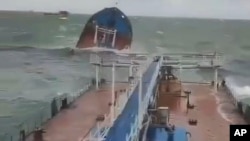 This photo taken from a video released by the Russian Southern Transport Prosecutor's Office, shows Volgoneft 212 tanker wrecked by a storm in the Kerch Strait on December 15.