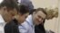 Aleksei Navalny (second from right) confers with his legal team during the court hearing in Kirov on April 24.