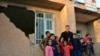 Iranian soccer (football) legend Ali Daei, with quake-stricken children in Kermanshah Province