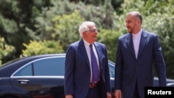 Iranian Foreign Minister Hossein Amir-Abdollahian (right) and European Union foreign policy chief Josep Borell in Tehran on June 25.