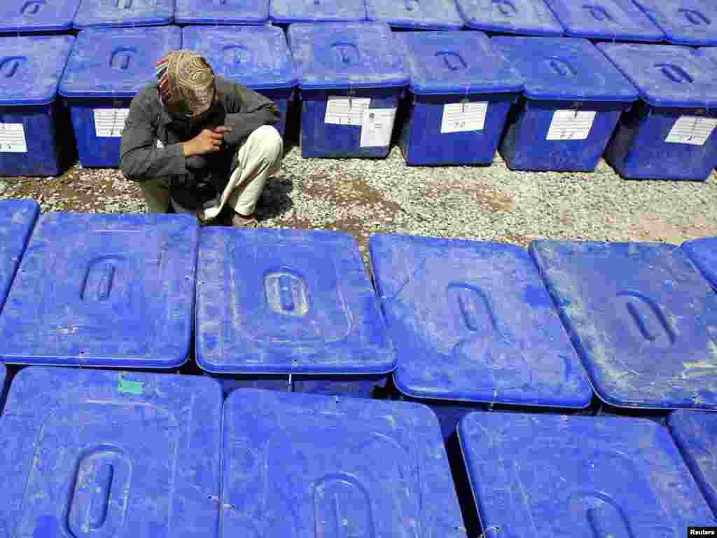 Afghanistan -- A worker sorts ballot boxes to be distributed to polling stations, at counting center in Kandahar province, 16Sep2010 - An Afghan worker sorts ballot boxes be distributed to polling stations, at counting center in Kandahar province, September 16, 2010. REUTERS/Omar Sobhani (AFGHANISTAN - Tags: ELECTIONS POLITICS) potw37 10poty