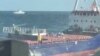 Кадър от видео, в което е заснето как руски сили спират кораба "Сукру Окан" в Черно море