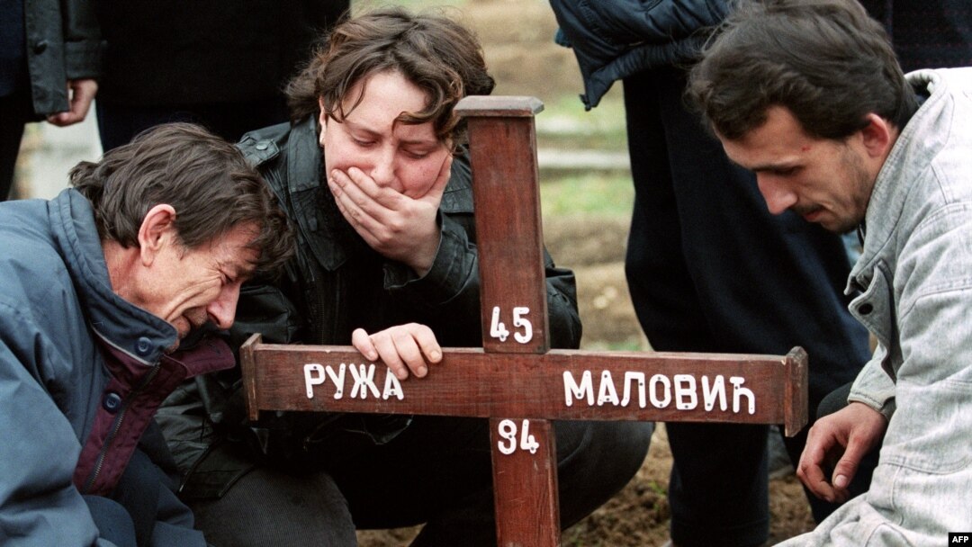 A Sarajevan Serb family mourns a victim of the Sarajevo marketplace massacre in the besieged Bosnian capital on February 7, 1994.