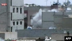 Syria -- A video grab shows shelling by government forces of the Damascus suburb of Duma, 26Jun2012