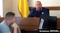 Ukrainian Judge Serhiy Vovk presides in court.