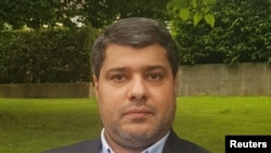 Amir Moghadam poses for a photo in a park, June 14, 2020, in this handout image provided to Reuters on June 15, 2020.