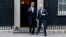 U.S. Secretary of State John Kerry (left) and Britain's Foreign Secretary William Hague leave No. 10 Downing Street in London on February 25.