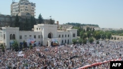 People demonstrate against the Syrian government after Friday Prayers in Hama on July 29.