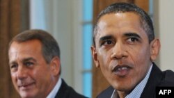 Republican House Speaker John Boehner (left) with President Barack Obama at debt talks in Washington on July 10