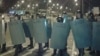 Kazakh riot police cordon off the territory of Prime Plaza after the concert by Kairat Nurtas in Almaty on August 31.