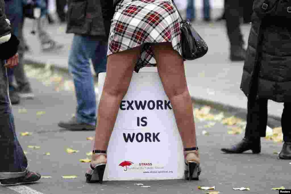 France -- A sex worker activist attends a demonstration with prostitutes against a proposal to scrap sanctions on soliciting and instead punish prostitutes' customers with fines, in Paris, November 29, 2013