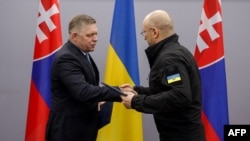 Slovak Prime Minister Robert Fico (left) meets his Ukrainian counterpart, Denys Shmyhal, in Uzhhorod on January 24. 