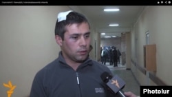 Armenia -- Opposition activist Gevorg Safaryan is interviewed by RFE/RL after being assaulted in Yerevan, 28 Nov2014.