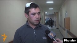 Armenia -- Opposition activist Gevorg Safarian is interviewed by RFE/RL after being assaulted in Yerevan, 28 Nov2014