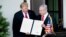 U.S. President Donald Trump (left) and Israeli Prime Minister Benjamin Netanyahu hold up the Golan Heights proclamation after a meeting in the the White House in Washington on March 25.