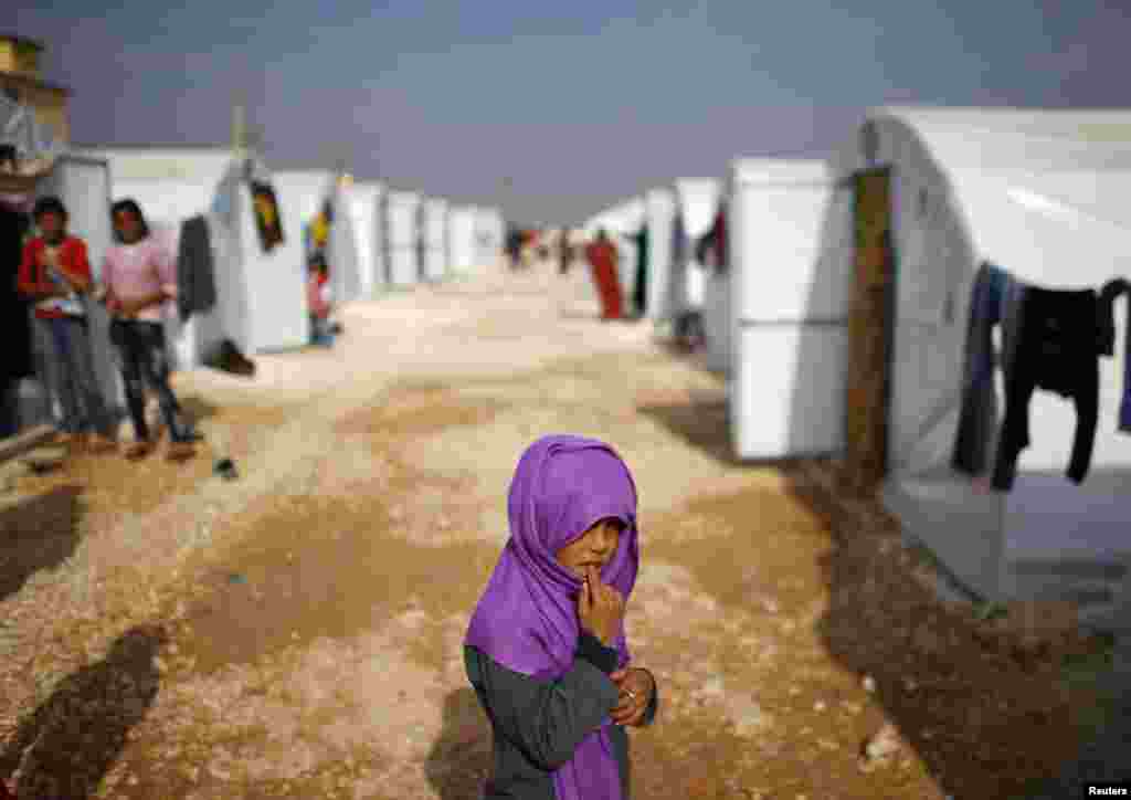 A Kurdish refugee girl from the Syrian town of Kobani is seen in a refugee camp in the Turkish border town of Suruc, in Sanliurfa province. (Reuters/Osman Orsal)