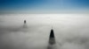 Fog floats around the pylons of the Megyeri Bridge in Budapest, Hungary. (epa-EFE/Balaczs Mohai)