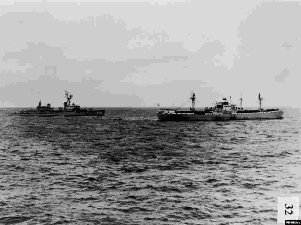 With the U.S. blockade in force, the &quot;USS Joseph P. Kennedy&quot; distroyer&#39;s crew boards and inspects the &quot;Marucla,&quot; a dry-cargo ship under the Lebanese flag and under Soviet charter to Cuba, on October 26, 1962.