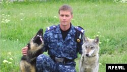 A police officer with the breeding pair.