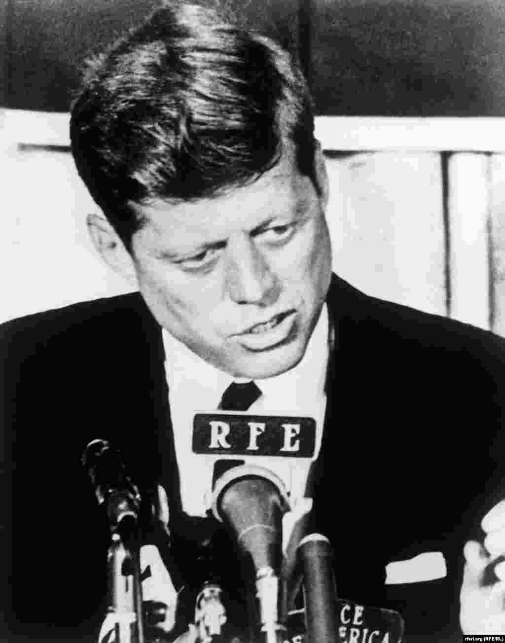 U.S. President John F. Kennedy speaks into an RFE microphone in the early 1960s. - U.S. President John F. Kennedy speaks into an RFE microphone in the early 1960s. 