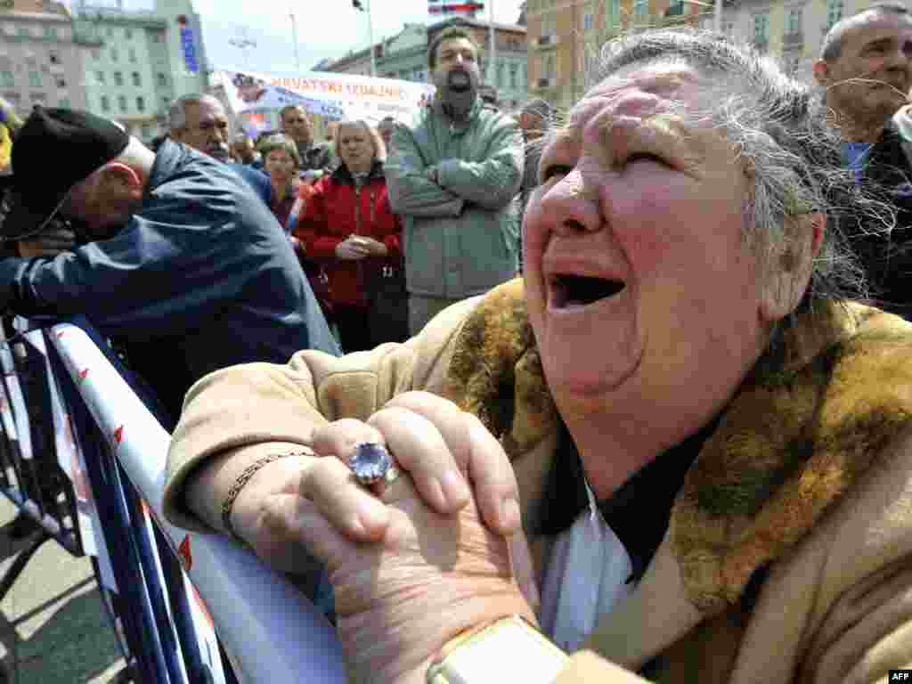 People react after hearing the verdict for Croatian General Ante Gotovina, accused by The Hague's International Criminal Tribunal for former Yugoslavia, in Zagreb's main square on April 15. Gotovina was sentenced to 24 years in prison for war crimes. Photo by Hrvoje Polan for AFP