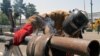 Iranian worker Amir Ghanbari welds a gas pipe at Tehran's Oil, Gas, Petrochemical Show, Iran, Thursday, April 20, 2006.