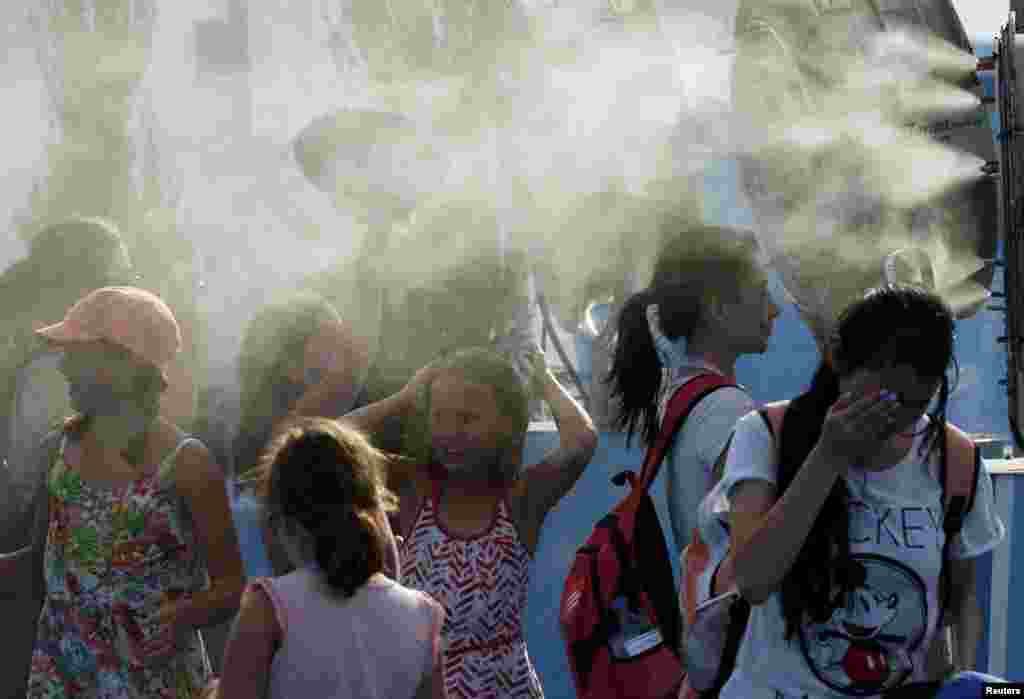 Rashladni uređaji za publiku, Melbourne, 15. januar 2014. Foto: REUTERS / Jason Reed 