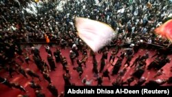 Shi'ite Muslim pilgrims beat their chests as they commemorate the Arbaeen in Karbala, October 30, 2018