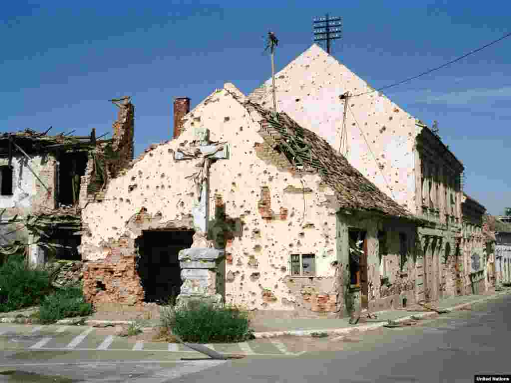 A Catholic church riddled with bullet holes, Vukovar, September 1992.