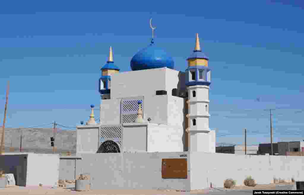 Medina Wasl began with just a few shipping containers but grew to incorporate a mosque and a working hotel.