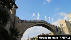Spectators watch as competitors take the dive off Mostar's Old Bridge on July 29.