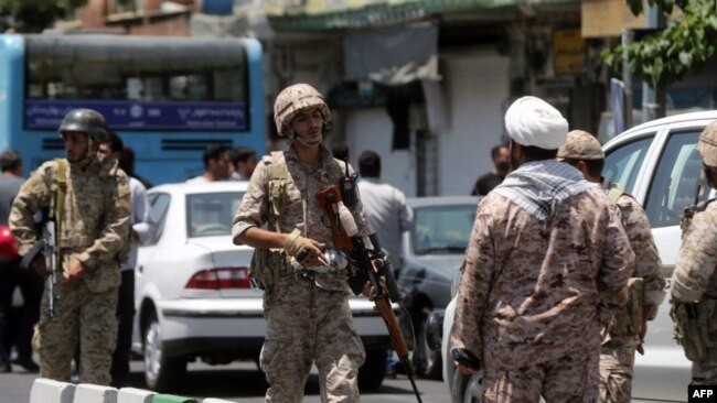 Members of the Iranian Revolutionary Guard secure the area outside the Iranian parliament during an attack on the complex in the capital Tehran, June 7, 2017