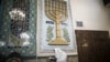 An Iranian Jewish man wearing a Tallit reads the Torah during morning prayers at the Yussef Abad Synagogue in Tehran.