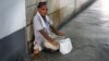 A man begs on the street in the Uzbek capital, Tashkent. Uzbekistan is one of the countries hardest hit by inflation since Russia's invasion of Ukraine. (file photo)