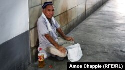 A man begs on the street in the Uzbek capital, Tashkent. Uzbekistan is one of the countries hardest hit by inflation since Russia's invasion of Ukraine. (file photo)