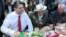 Armenia -- Prime Minister Tigran Sarkisian (L) shares meal with World War II veterans in Yerevan's Victory Park, 9May2012.