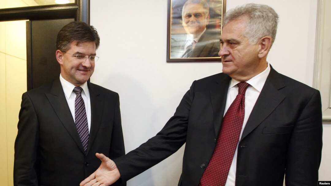 President-elect Tomislav Nikolic (right) greets Slovak Foreign Minister Miroslav Lajcak in Belgrade on May 24.